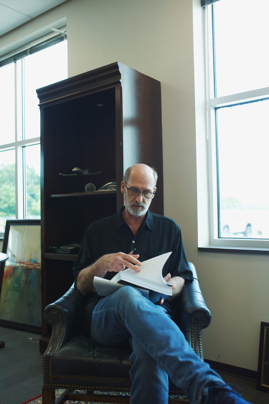 Daniel D. Barks reviewing case documents in his office